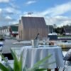Round beige tablecloth with blue lines, made from recycled linen blend, sustainable Nordic design