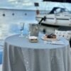 Round beige tablecloth with blue stripes, made from recycled linen blend, sustainable Nordic design