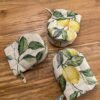 Oven glove with double wool filling from the Lemon Linen collection by Hortensias Home, cotton–linen fabric with vibrant lemon print