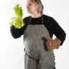 Lininė prijuostė su odos detalėmis KOOSdisain linen apron with black and grey herringbone pattern and repurposed leather details, handmade Nordic-style kitchen and studio apron