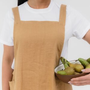 NUSS Japanese-style linen apron with cross-back design, earth-tone unisex apron in thick natural linen with pockets, handmade in Latvia
