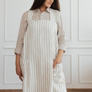 NUSS Linen Crossed Back Apron in 100% natural linen with side pockets and adjustable straps, handmade in Latvia