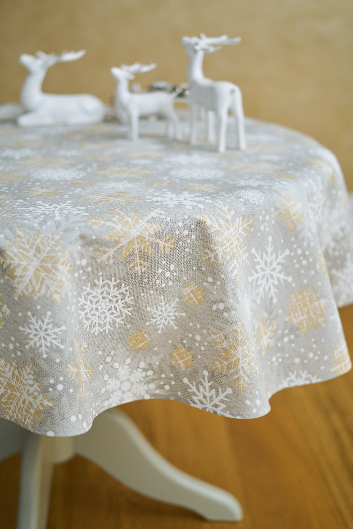 Christmas Motive Snowflakes Round Tablecloth Snowflakes round tablecloth with gold and grey print, cotton–polyester blend, handmade in Europe